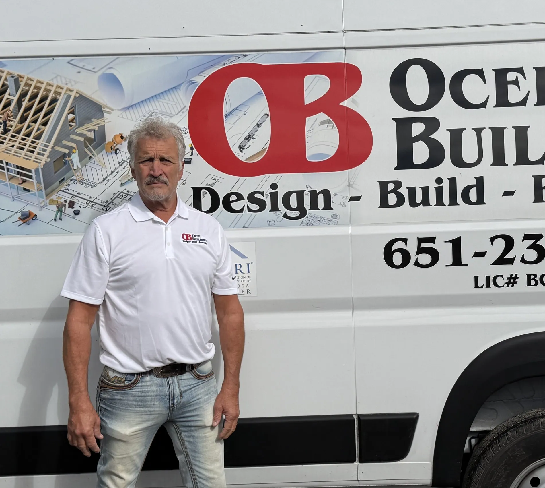 Matt Ocel standing beside an Ocel Builders van