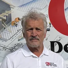 Matt Ocel, owner of Ocel Builders, outside a company van